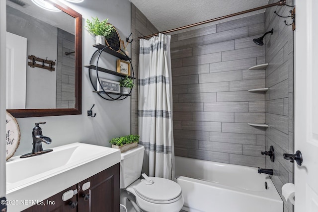 full bath with shower / bathtub combination with curtain, a textured ceiling, vanity, and toilet