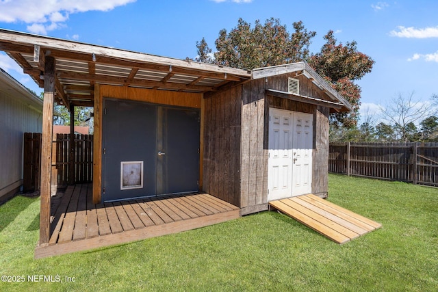 view of outbuilding featuring an outbuilding and a fenced backyard