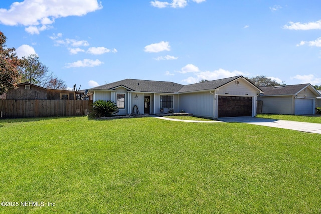 ranch-style house with a garage, driveway, a front lawn, and fence