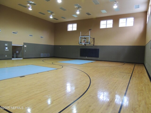 view of sport court featuring a wealth of natural light and community basketball court