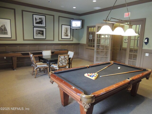 game room featuring recessed lighting, a decorative wall, carpet, wainscoting, and crown molding