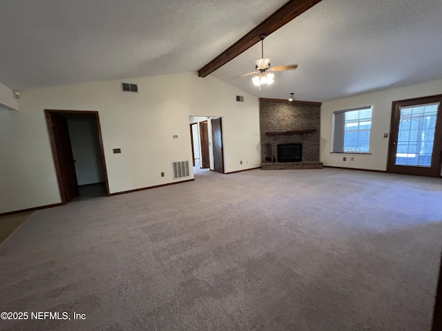 unfurnished living room featuring visible vents, vaulted ceiling with beams, carpet, ceiling fan, and a fireplace