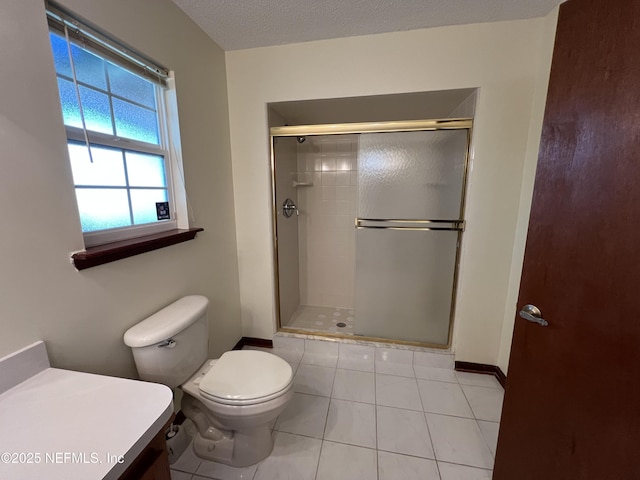 bathroom featuring tile patterned floors, a shower stall, toilet, and baseboards