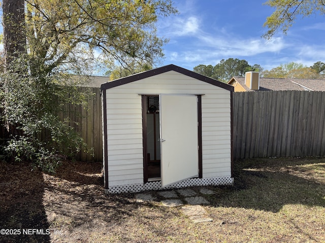 view of shed featuring a fenced backyard