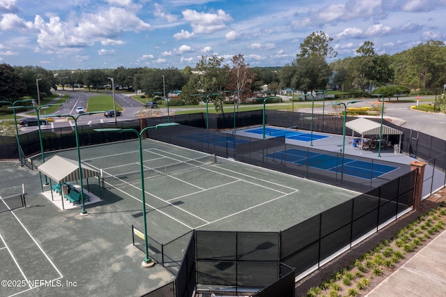 view of sport court with fence