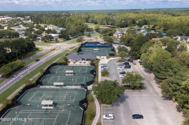 drone / aerial view featuring a view of trees