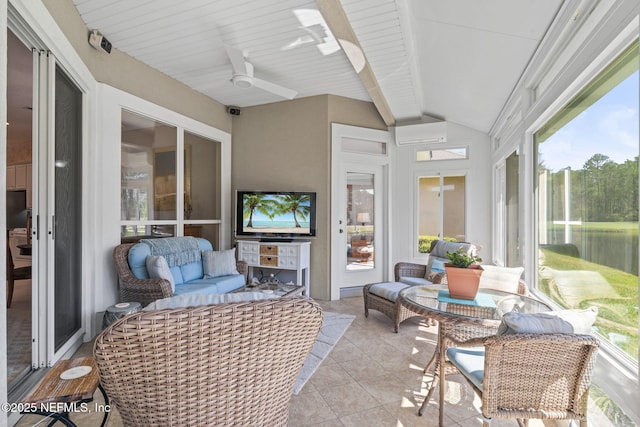 sunroom / solarium featuring a ceiling fan and vaulted ceiling