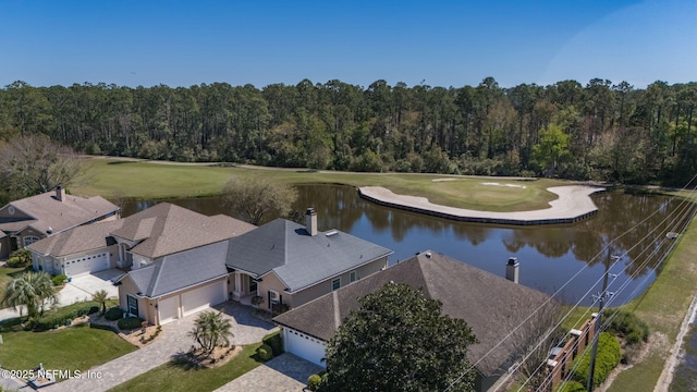 birds eye view of property with a water view, a wooded view, and golf course view