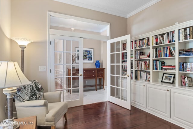 living area with french doors, dark wood-style flooring, and ornamental molding