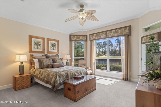 bedroom featuring ornamental molding, a textured ceiling, baseboards, light colored carpet, and ceiling fan