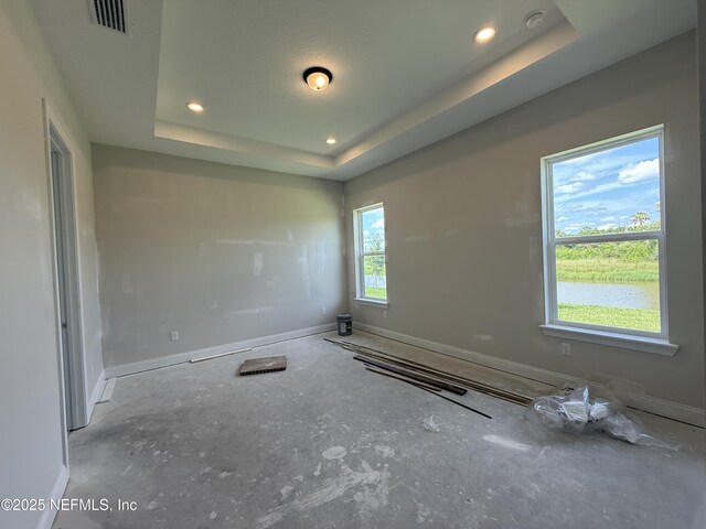 286 Lamego Ln, Saint Augustine, FL 32095 - spare room featuring a smoke detector, a raised ceiling, and recessed lighting
