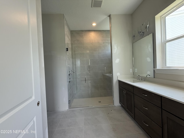 286 Lamego Ln, Saint Augustine, FL 32095 - bathroom featuring vanity, tile patterned floors, a stall shower, and recessed lighting