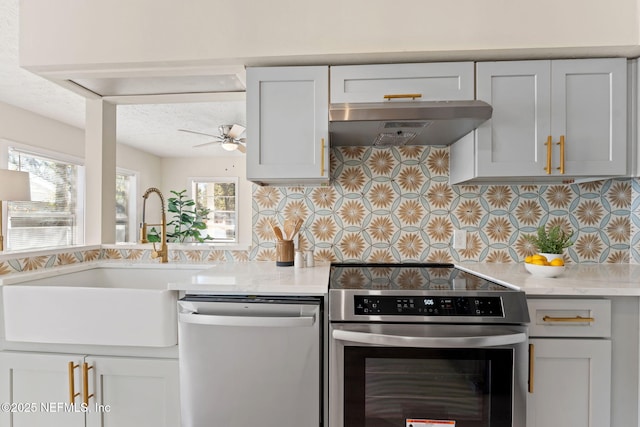 4517 Delta Ave, Jacksonville, FL 32205 - kitchen with stainless steel appliances, ventilation hood, backsplash, and a ceiling fan