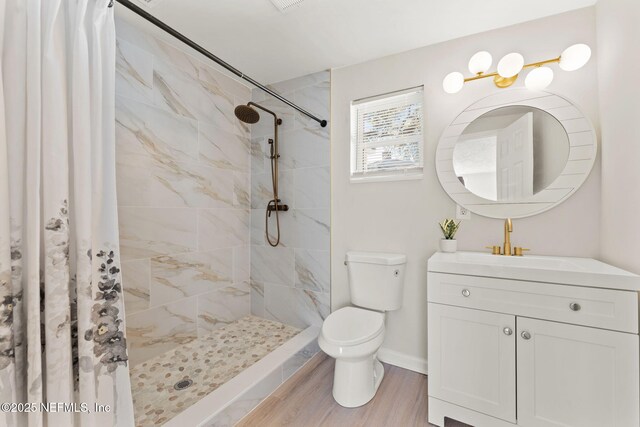 4517 Delta Ave, Jacksonville, FL 32205 - full bath with vanity, a tile shower, and wood finished floors