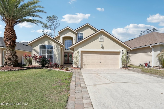 traditional-style home featuring stucco siding, a garage, driveway, and french doors