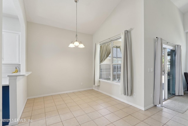 unfurnished dining area with a wealth of natural light, baseboards, an inviting chandelier, and light tile patterned flooring