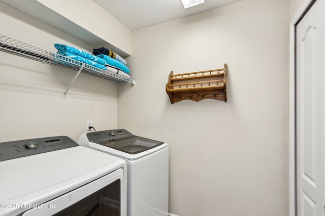 washroom with laundry area and washing machine and dryer