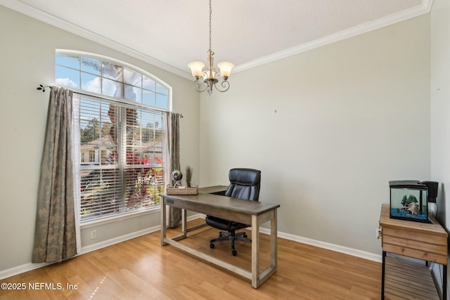 home office with ornamental molding, baseboards, light wood finished floors, and a chandelier