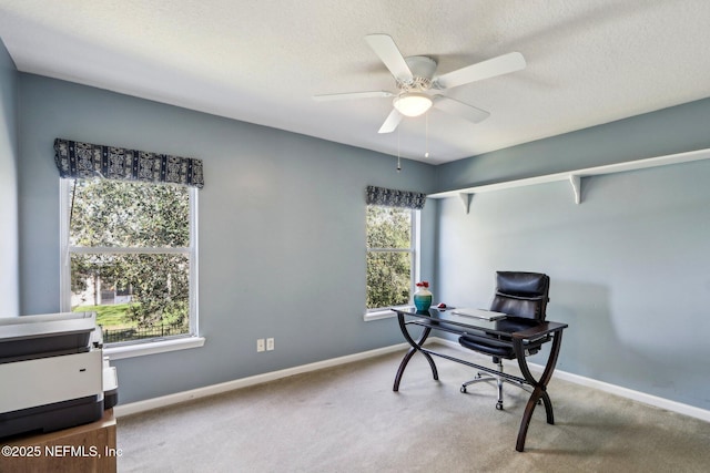 office with carpet flooring, baseboards, and ceiling fan