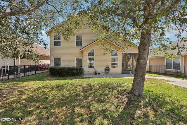 view of front of house with a front yard and fence