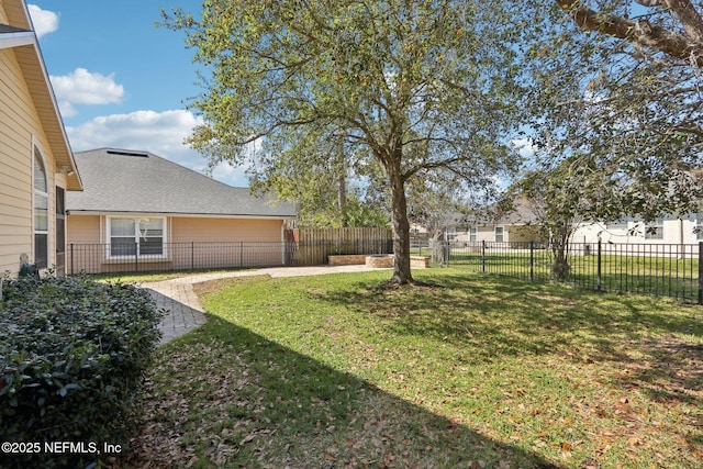 view of yard with a fenced backyard