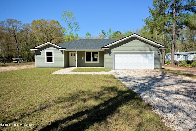 single story home with a front yard, an attached garage, driveway, and a shingled roof