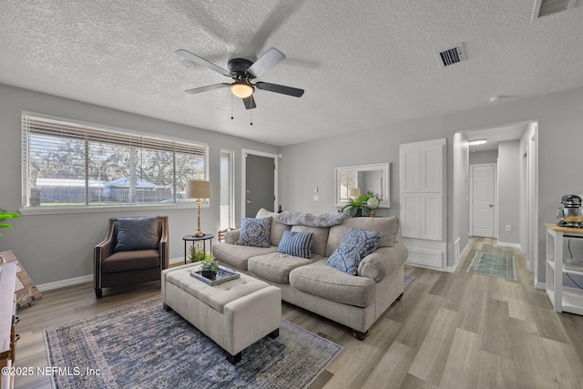 1516 Prospect St, Palatka, FL 32177 - living area featuring ceiling fan, visible vents, baseboards, and light wood-style flooring