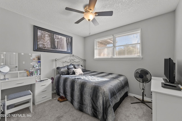1516 Prospect St, Palatka, FL 32177 - bedroom featuring light carpet, baseboards, a textured ceiling, and ceiling fan