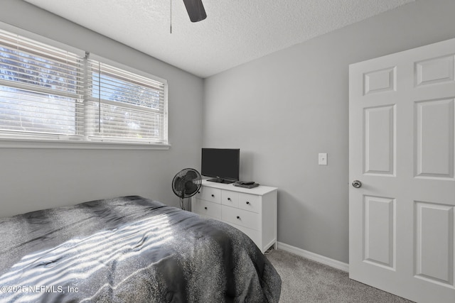 1516 Prospect St, Palatka, FL 32177 - bedroom featuring light colored carpet, a textured ceiling, baseboards, and ceiling fan