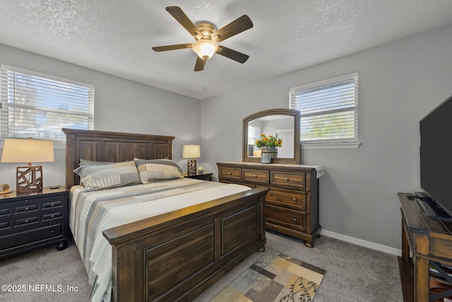 1516 Prospect St, Palatka, FL 32177 - bedroom featuring light colored carpet, a textured ceiling, baseboards, and ceiling fan