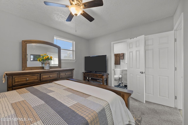 1516 Prospect St, Palatka, FL 32177 - bedroom with a textured ceiling, a ceiling fan, ensuite bathroom, and light carpet