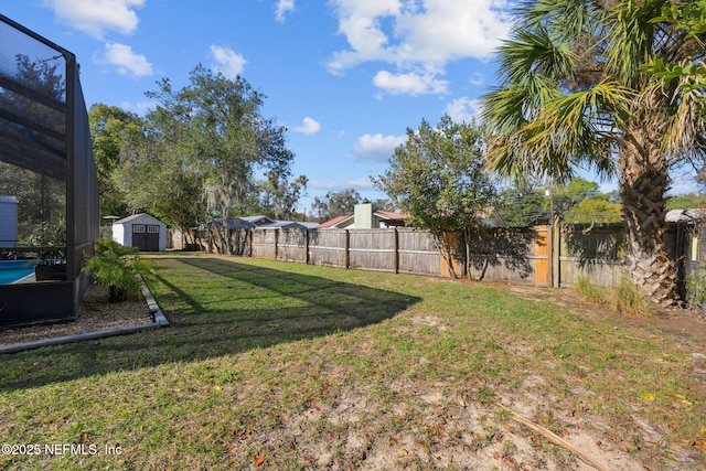 1516 Prospect St, Palatka, FL 32177 - view of yard featuring an outbuilding, a storage unit, and a fenced backyard