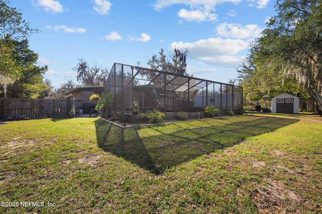 1516 Prospect St, Palatka, FL 32177 - view of yard with glass enclosure, a storage shed, an outdoor structure, and fence