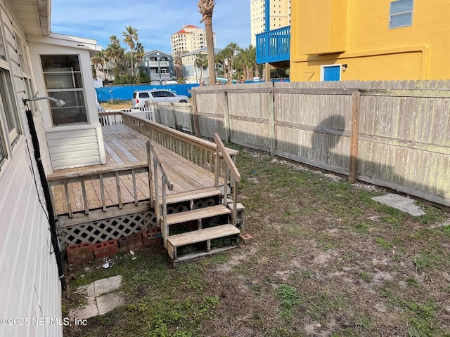 view of yard featuring a deck and fence