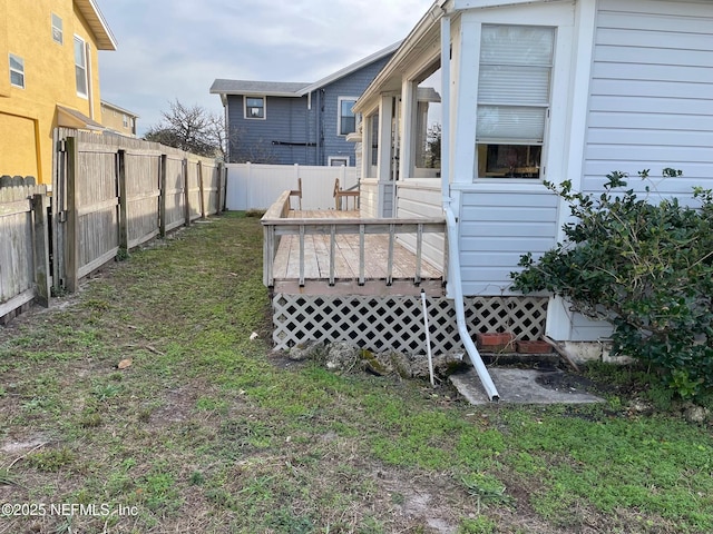 view of yard featuring a deck and a fenced backyard