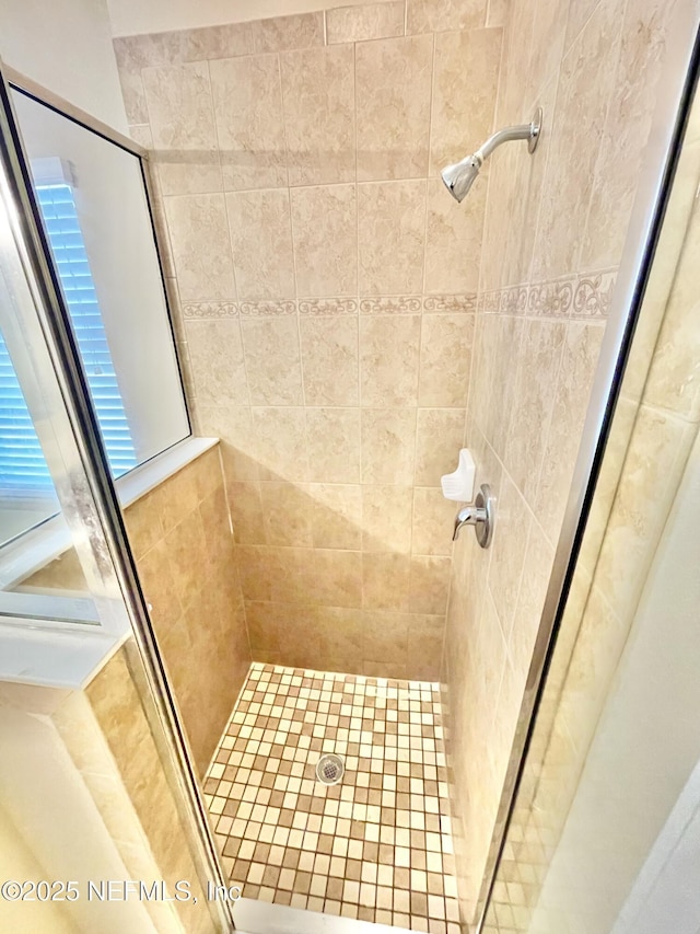 bathroom with a stall shower