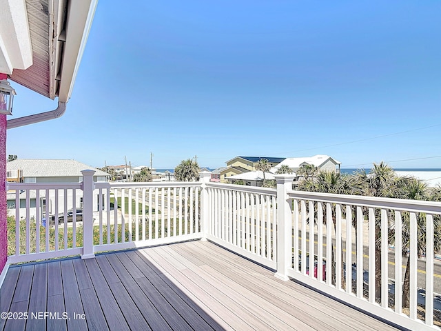 wooden terrace with a residential view