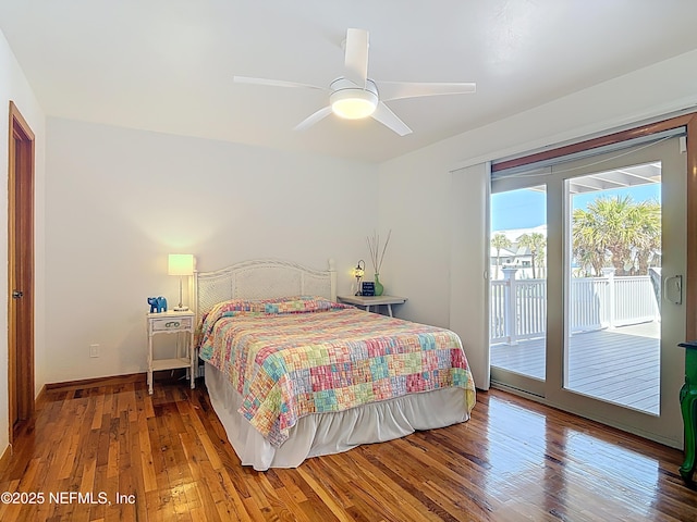 bedroom with access to exterior, a ceiling fan, baseboards, and hardwood / wood-style floors