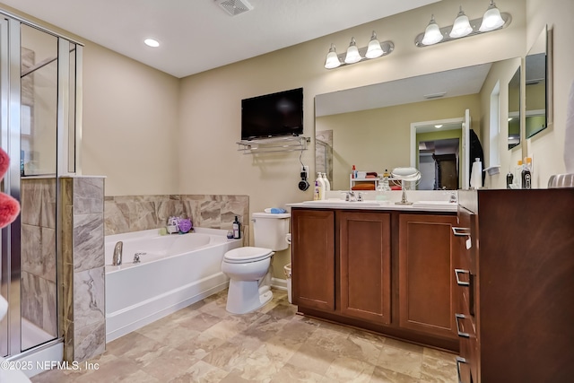 full bathroom with visible vents, a shower stall, a garden tub, double vanity, and a sink