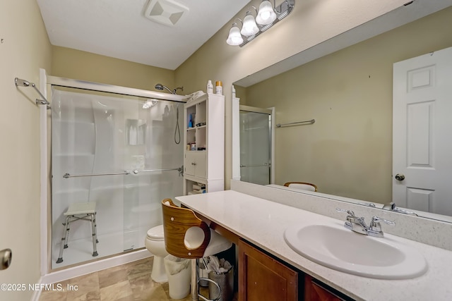 full bath with visible vents, toilet, a stall shower, and vanity