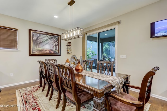 dining room featuring recessed lighting, baseboards, and wood finished floors