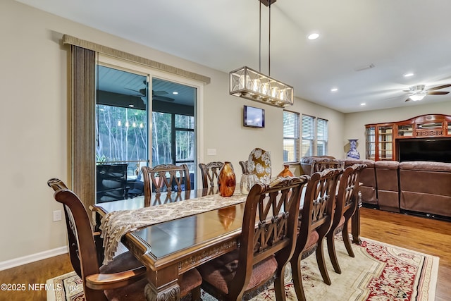 dining room featuring a ceiling fan, visible vents, wood finished floors, baseboards, and recessed lighting