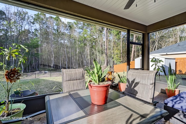 sunroom with a ceiling fan