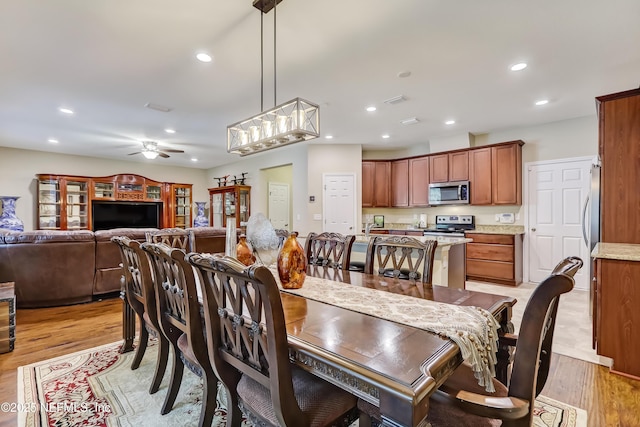 dining space with recessed lighting, visible vents, light wood-style floors, and ceiling fan