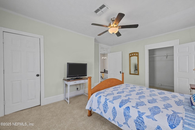 carpeted bedroom with ceiling fan, visible vents, a closet, and ornamental molding