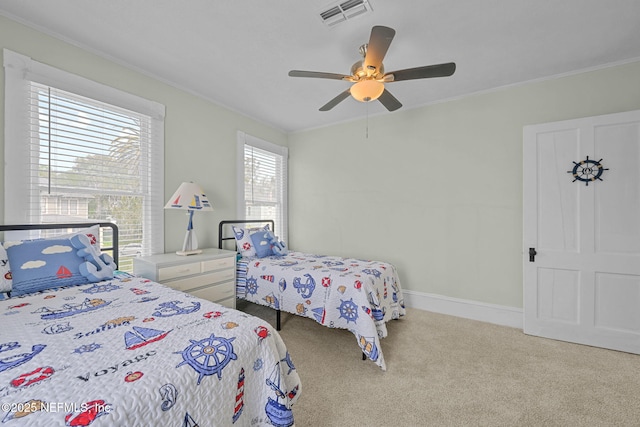 bedroom with visible vents, carpet floors, baseboards, and ornamental molding