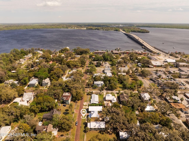 drone / aerial view with a residential view and a water view