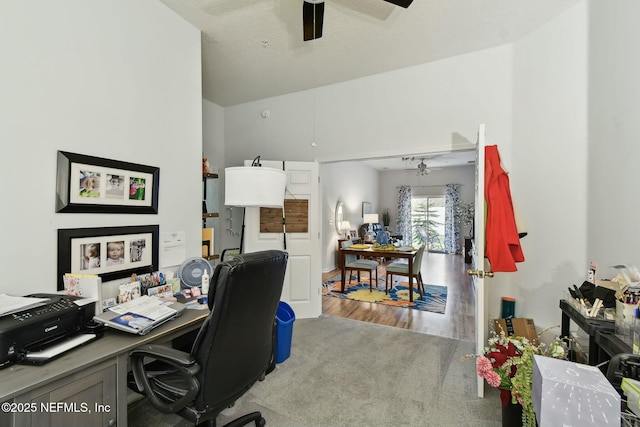 office area with a ceiling fan and wood finished floors