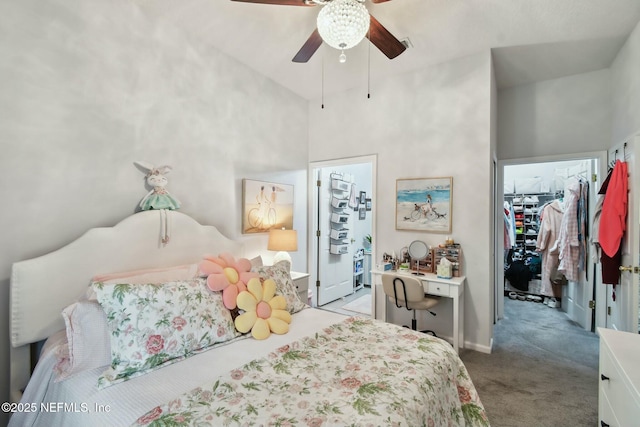 carpeted bedroom featuring a towering ceiling, a closet, ceiling fan, and a spacious closet