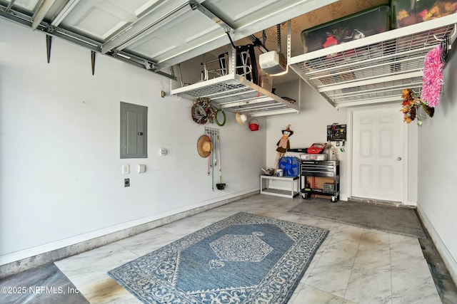 garage with electric panel, a garage door opener, and baseboards